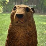 A carved wooden ground hog.