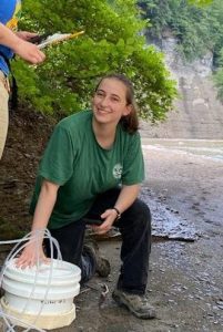 Figure 1. Katie conducting methane flux chamber measurements in western New York.