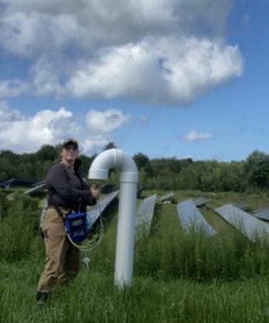Figure 9. Katie in the field measuring methane emissions from a landfill vent in the Mid-Hudson Region for HVRC.